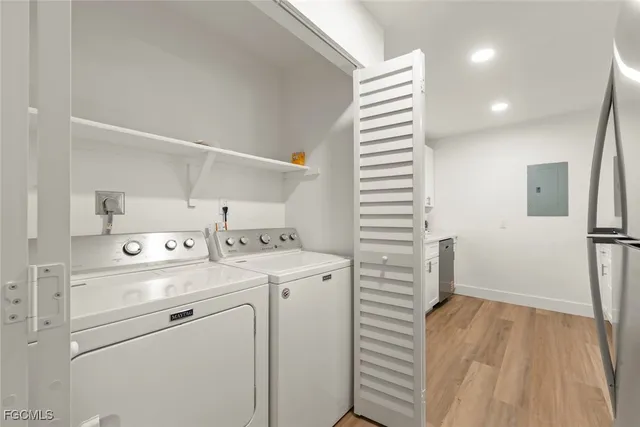 a view of storage and utility room with washer and dryer