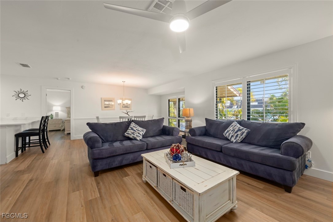 5117 Sea Bell Road, Unit D204 Sanibel, FL 33957 - Photo 8 of 50 a living room with furniture and a wooden floor