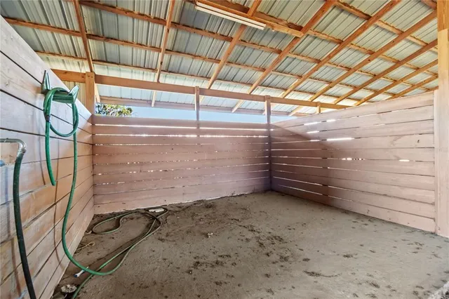 a view of a swimming pool with an outdoor seating and a yard