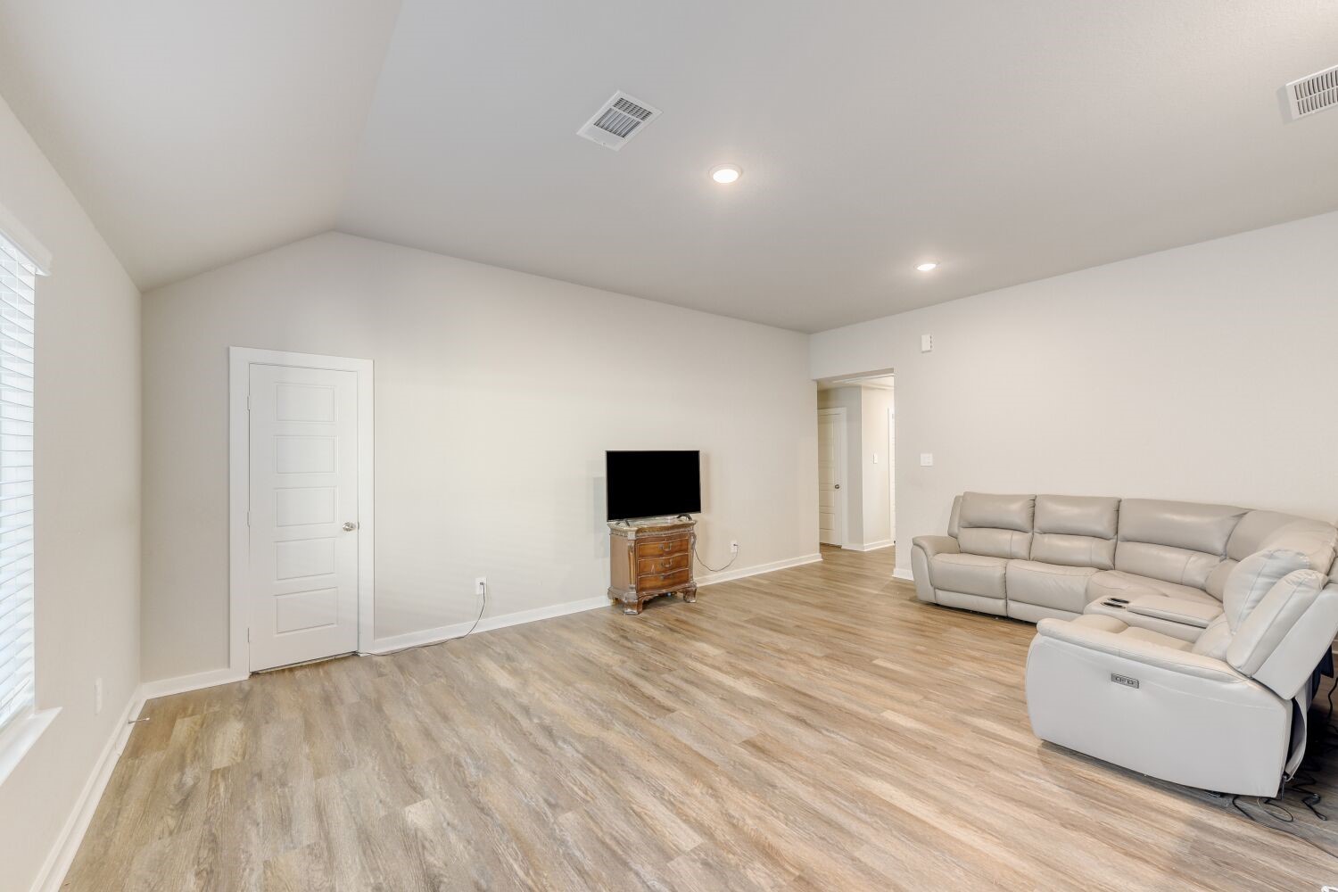 437 Ridge Palm Road Magnolia, TX 77354 - Photo 13 of 31 a living room with furniture and a flat screen tv