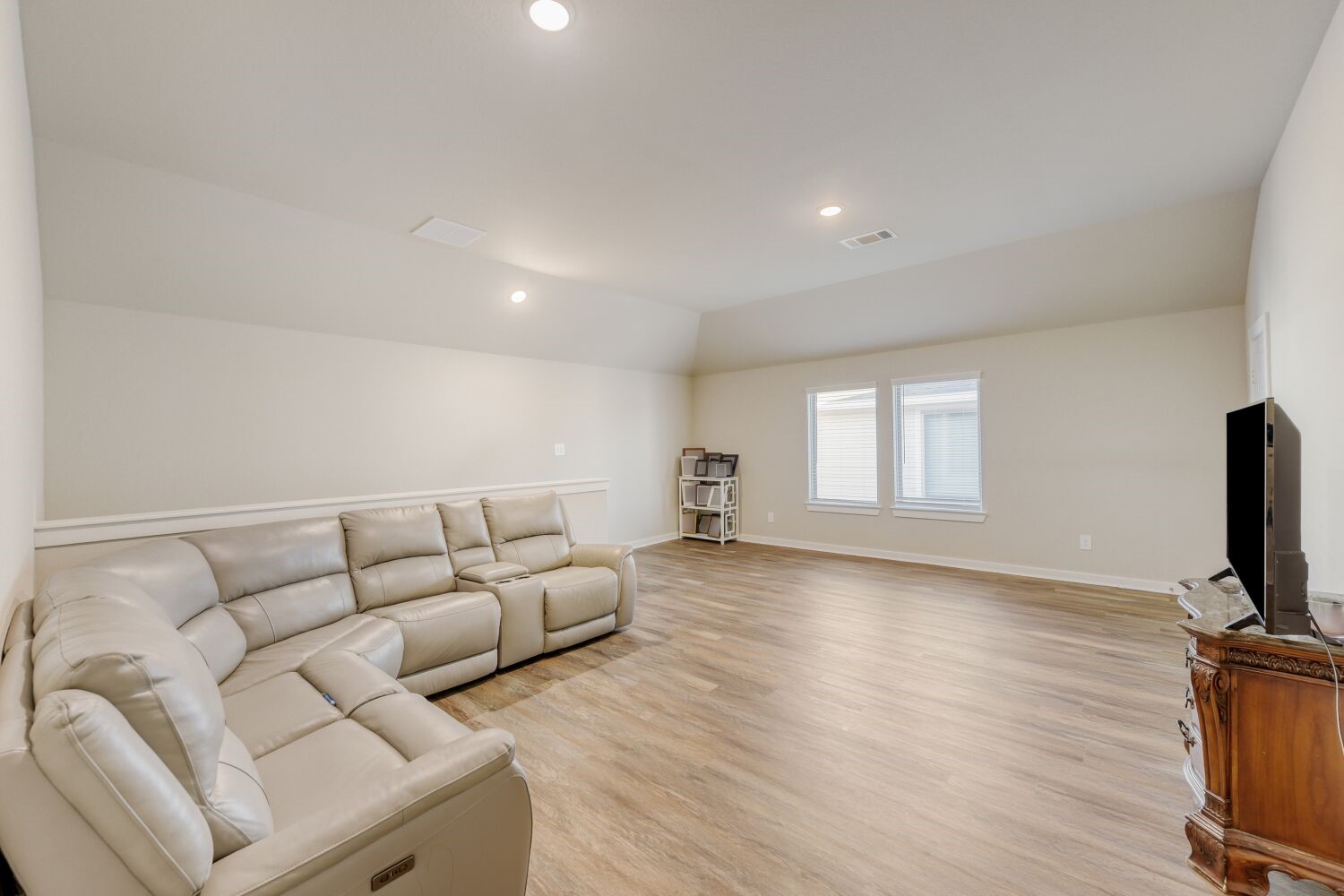 437 Ridge Palm Road Magnolia, TX 77354 - Photo 14 of 31 a living room with furniture and a flat screen tv