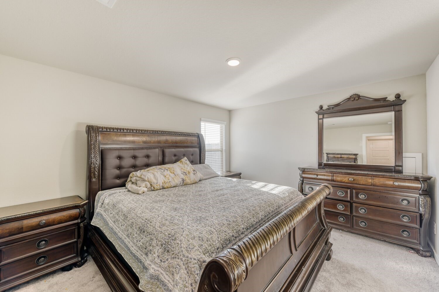 437 Ridge Palm Road Magnolia, TX 77354 - Photo 18 of 31 a bedroom with a bed and a dresser