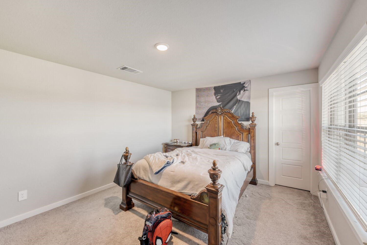 437 Ridge Palm Road Magnolia, TX 77354 - Photo 21 of 31 a bedroom with a bed and a window