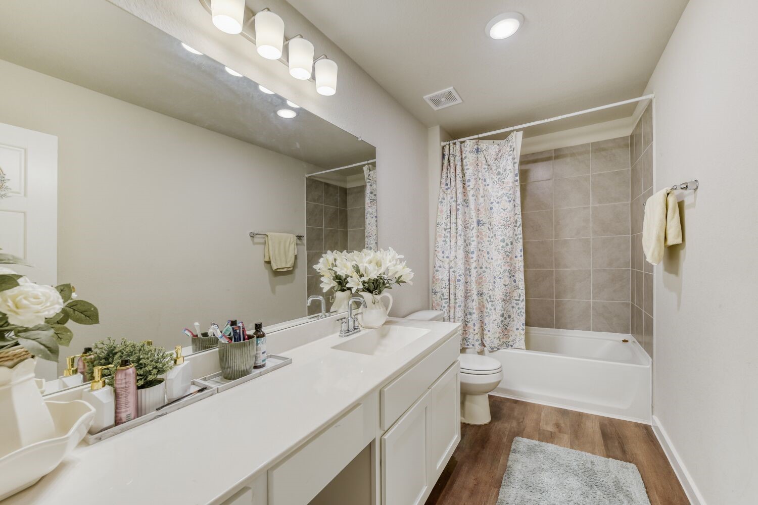 437 Ridge Palm Road Magnolia, TX 77354 - Photo 24 of 31 a bathroom with a sink double vanity granite tub shower and a mirror