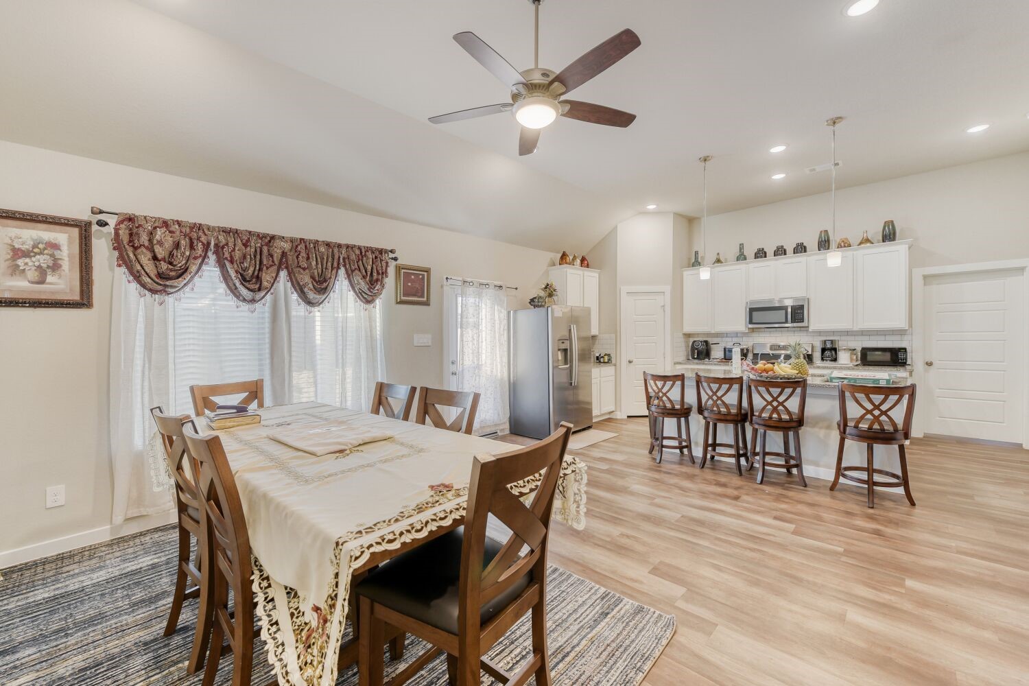 437 Ridge Palm Road Magnolia, TX 77354 - Photo 9 of 31 a view of a dining room with furniture and wooden floor