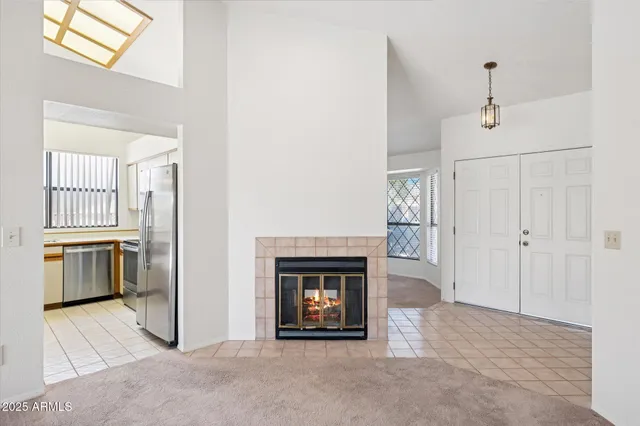 a view of an empty room with a fireplace