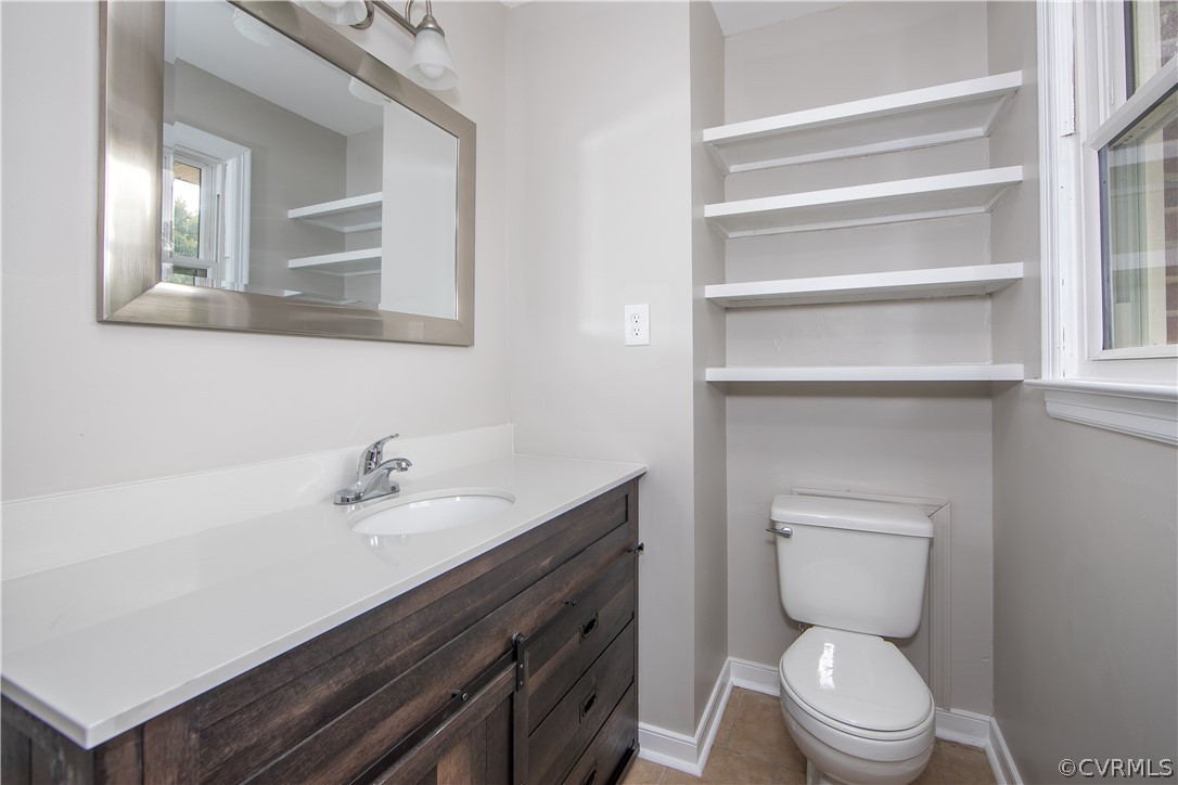 913 Yorkshire Road Colonial Heights, VA 23834 - Photo 17 of 26 Primary bedroom has 1/2 bath with ceramic tile flo