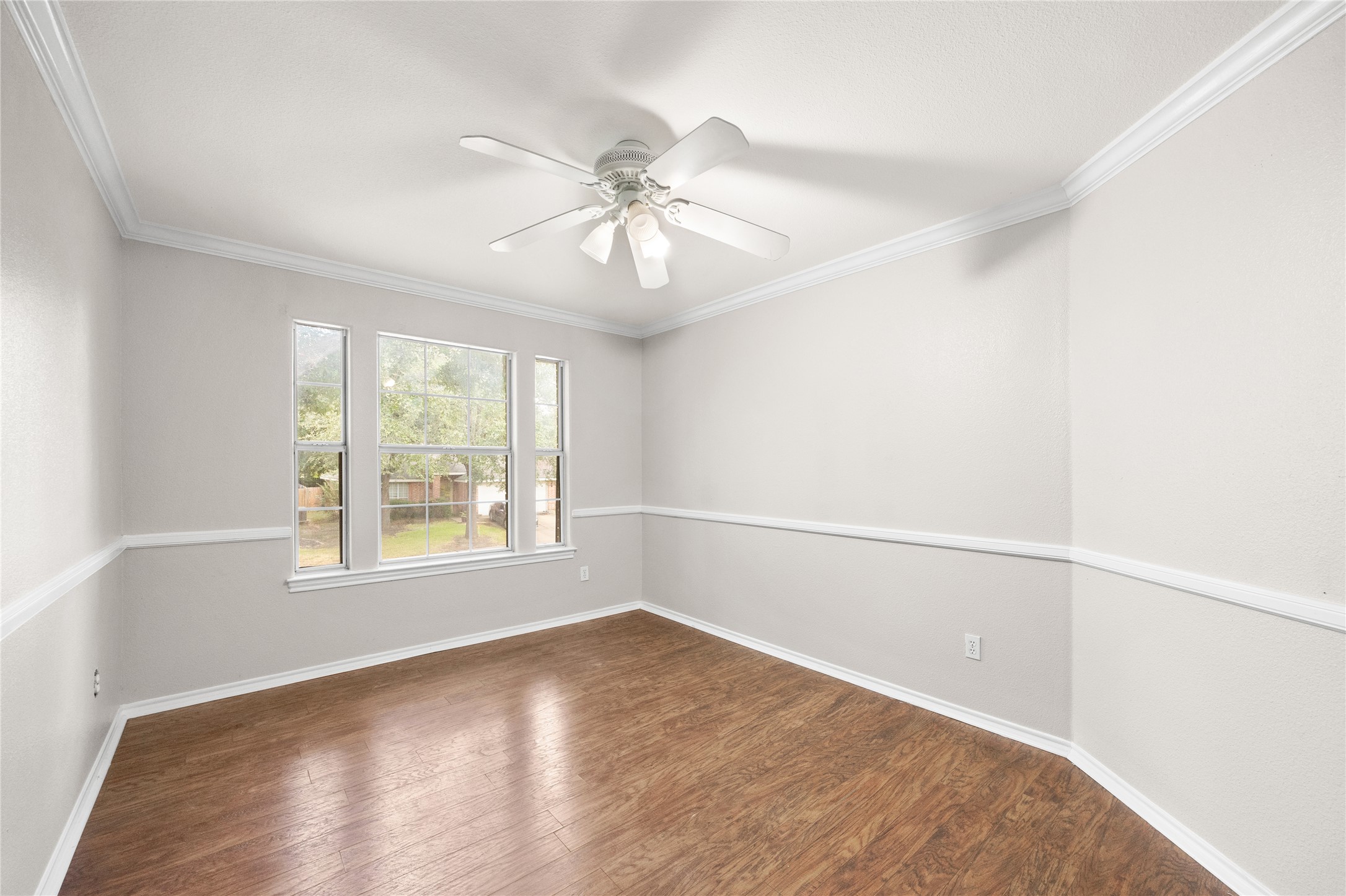 13217 Rochester Lane Austin, TX 78753 - Photo 23 of 30 Gleaming wood floors and elegant crown molding define this versatile living space.