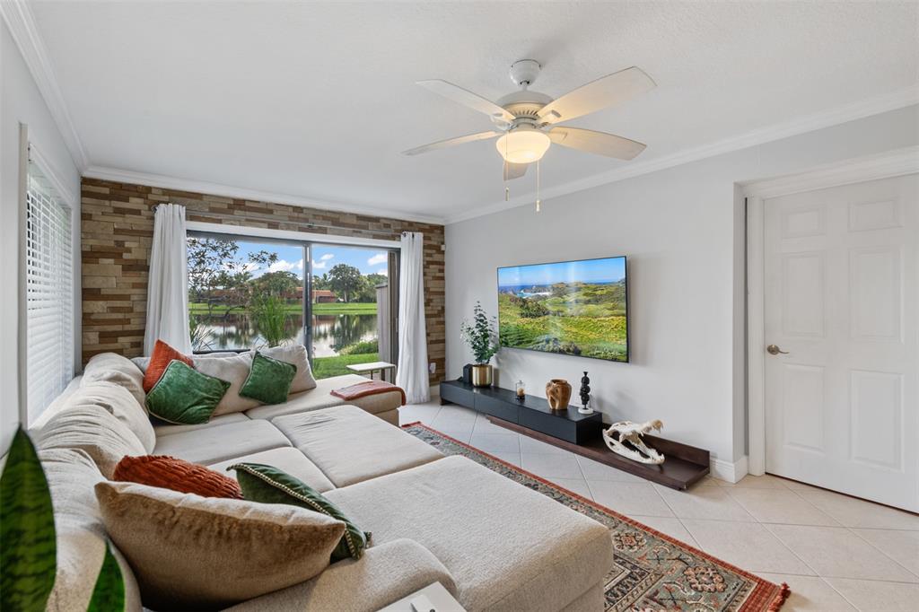 11927 Southwest 13th Court Davie, FL 33325 - Photo 12 of 41 a living room with furniture and a flat screen tv