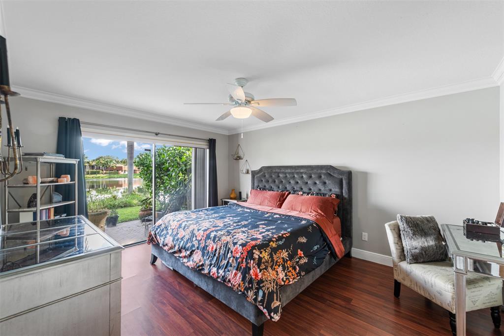 11927 Southwest 13th Court Davie, FL 33325 - Photo 23 of 41 a bedroom with a bed and a couch