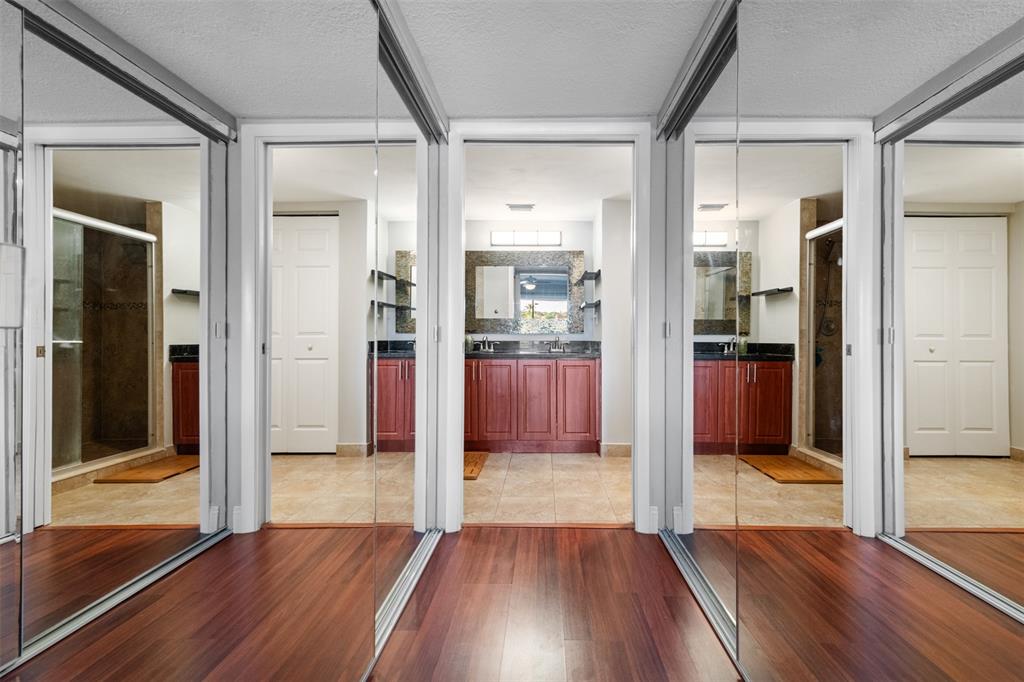 11927 Southwest 13th Court Davie, FL 33325 - Photo 25 of 41 a view of a hallway with wooden floor and glass door
