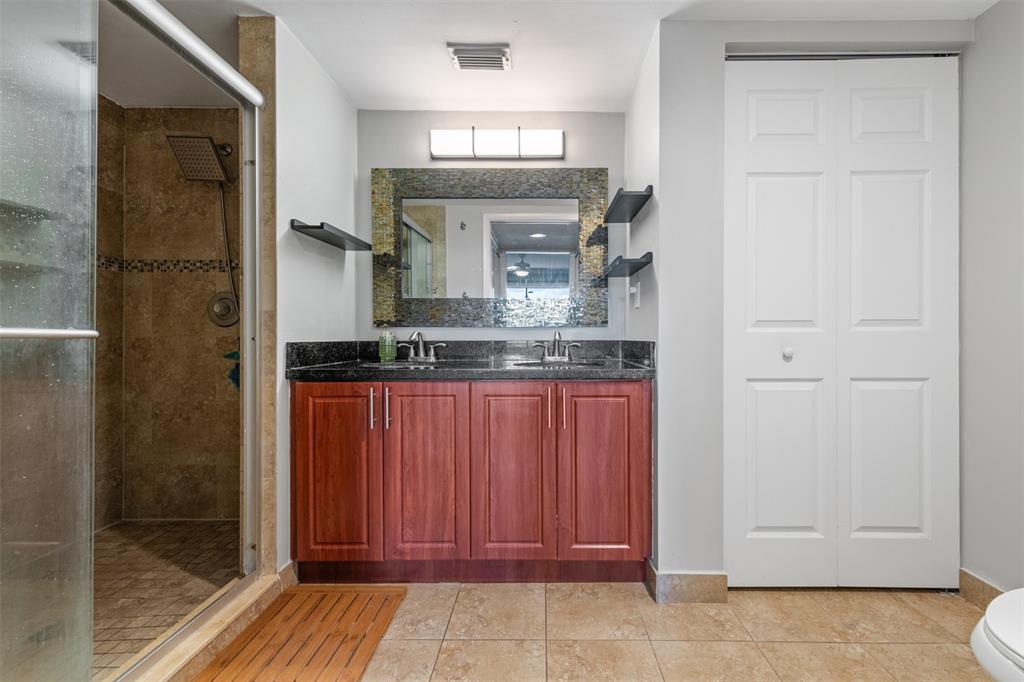 11927 Southwest 13th Court Davie, FL 33325 - Photo 26 of 41 a bathroom with a granite countertop sink and a mirror