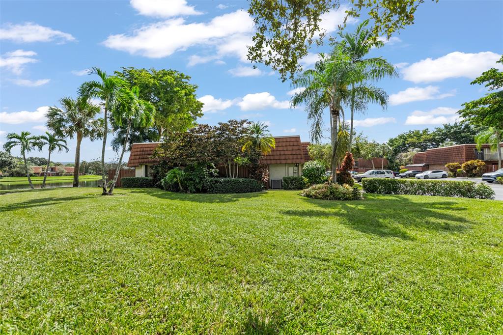 11927 Southwest 13th Court Davie, FL 33325 - Photo 30 of 41 a view of a garden with a building
