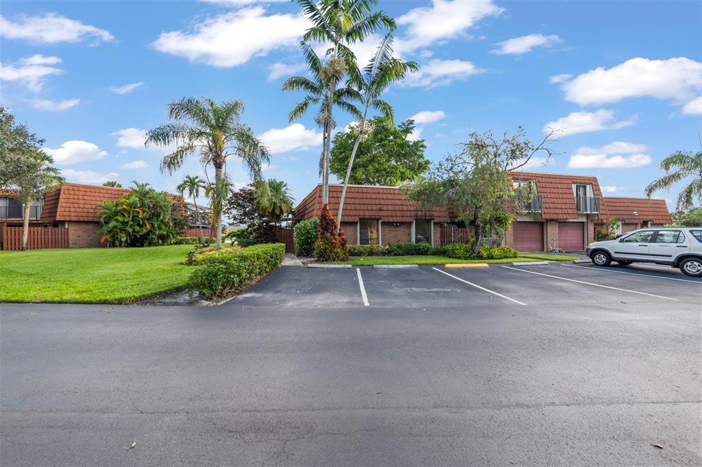 11927 Southwest 13th Court Davie, FL 33325 - Photo 3 of 41 a view of street with parked cars