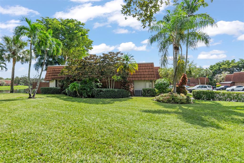11927 Southwest 13th Court Davie, FL 33325 - Photo 31 of 41 a view of a garden with a building