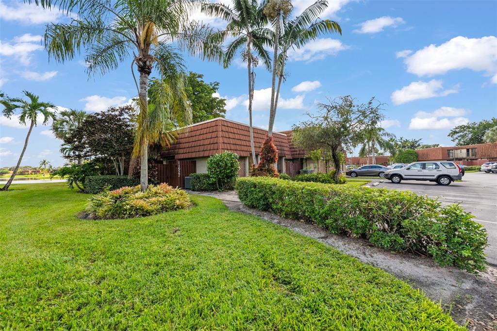 11927 Southwest 13th Court Davie, FL 33325 - Photo 6 of 41 a view of a garden with palm trees