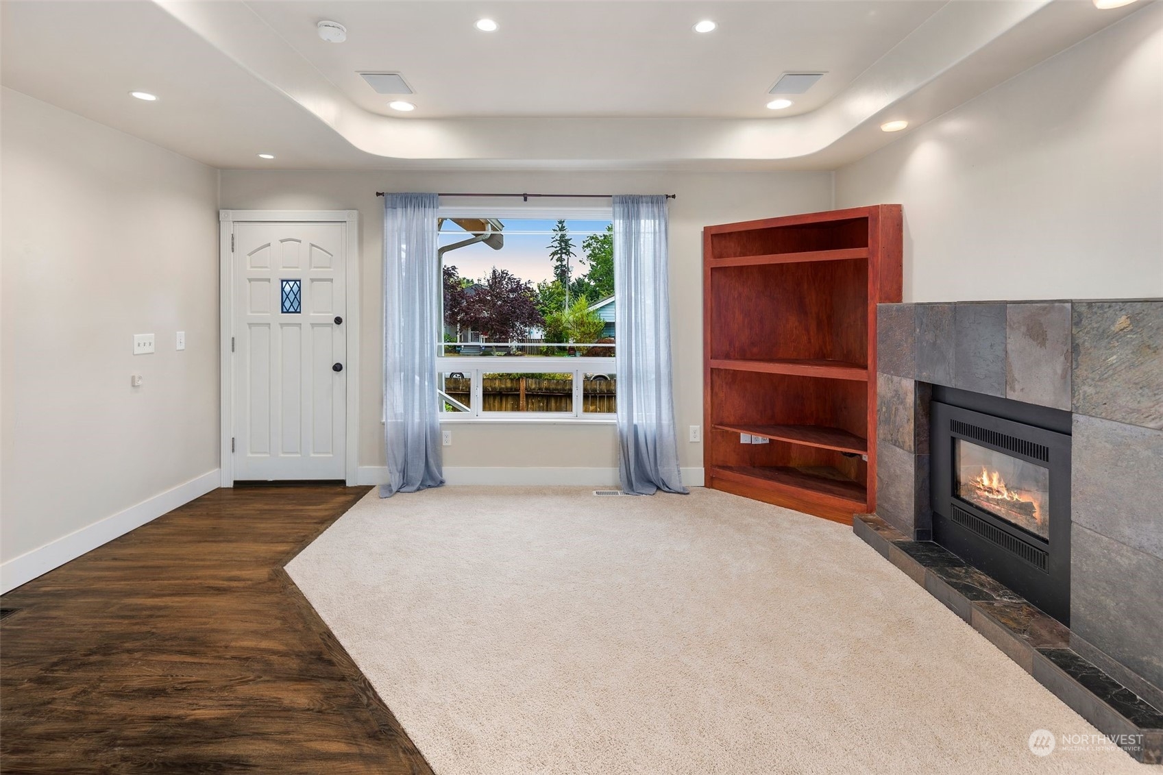 1524 Rockefeller Avenue Everett, WA 98201 - Photo 11 of 37 a view of an empty room with a fireplace and a window