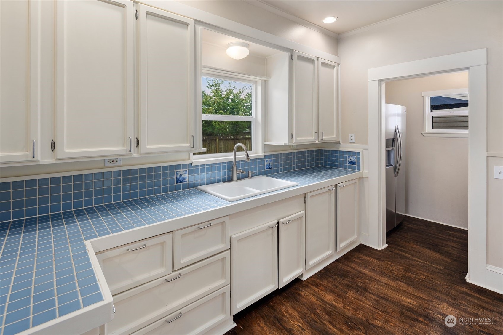 1524 Rockefeller Avenue Everett, WA 98201 - Photo 14 of 37 a kitchen with stainless steel appliances granite countertop a sink cabinets and wooden floor
