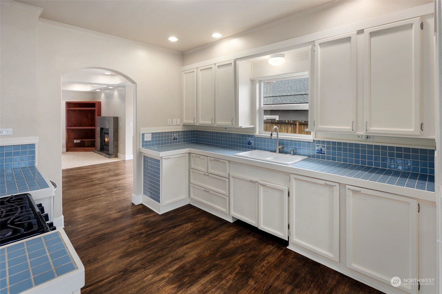 1524 Rockefeller Avenue Everett, WA 98201 - Photo 15 of 37 a kitchen with stainless steel appliances granite countertop a sink and cabinets with wooden floor