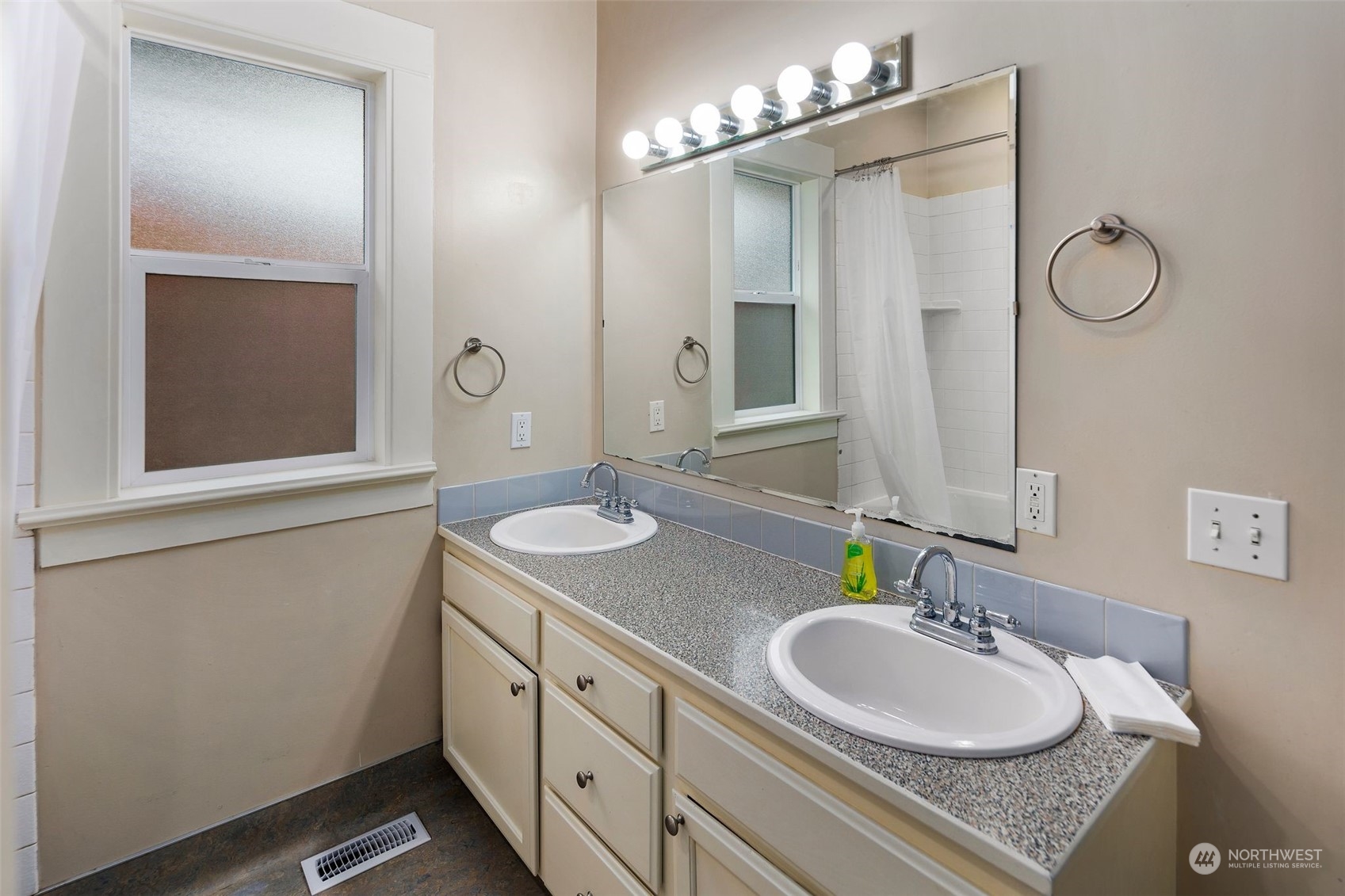 1524 Rockefeller Avenue Everett, WA 98201 - Photo 22 of 37 a bathroom with a granite countertop sink and a mirror