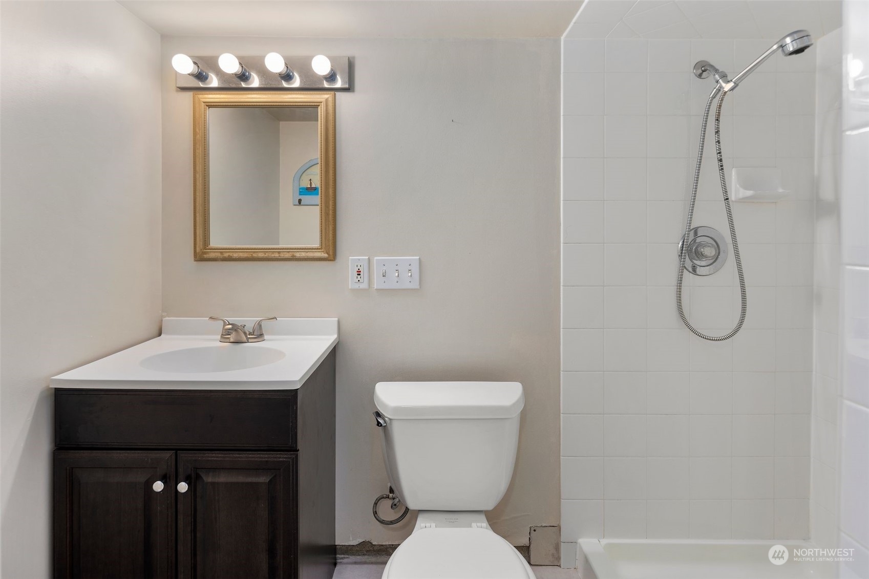 1524 Rockefeller Avenue Everett, WA 98201 - Photo 25 of 37 a bathroom with a sink a toilet and mirror