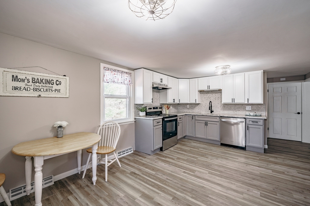 172 Bumstead Road Monson, MA 01057 - Photo 12 of 36 a kitchen with a sink cabinets and wooden floor