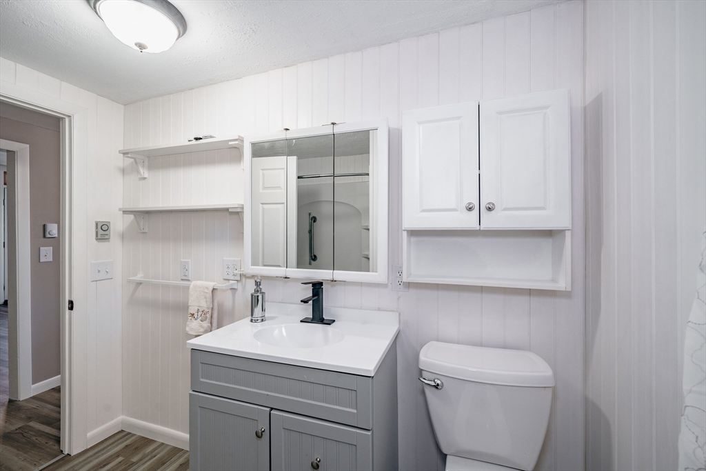 172 Bumstead Road Monson, MA 01057 - Photo 14 of 36 a bathroom with a toilet sink and mirror