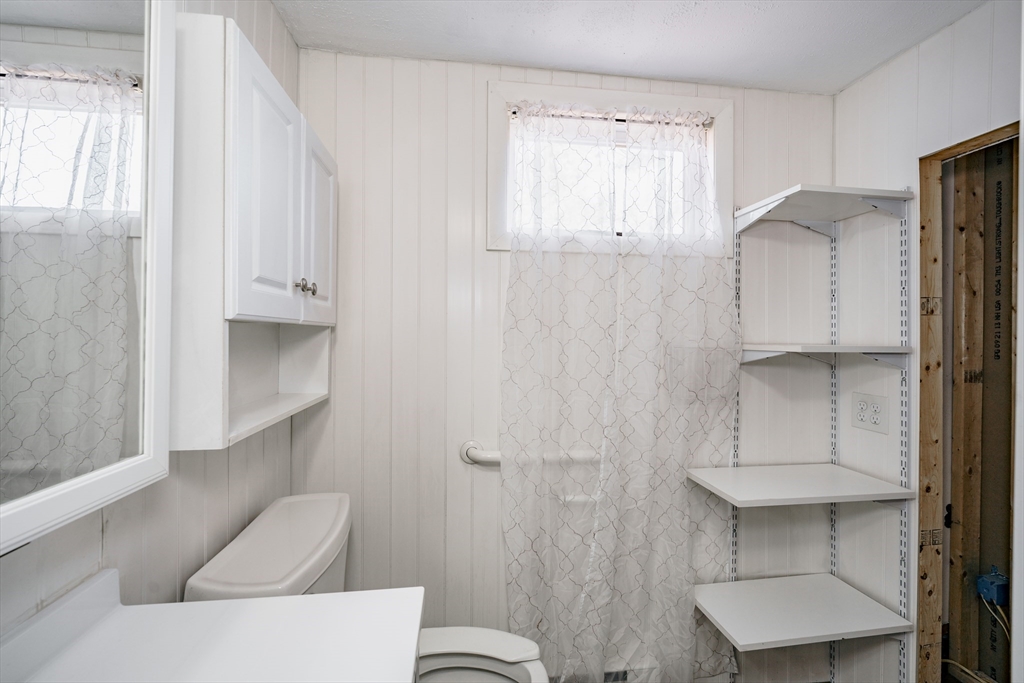 172 Bumstead Road Monson, MA 01057 - Photo 16 of 36 a bathroom with a toilet and a sink