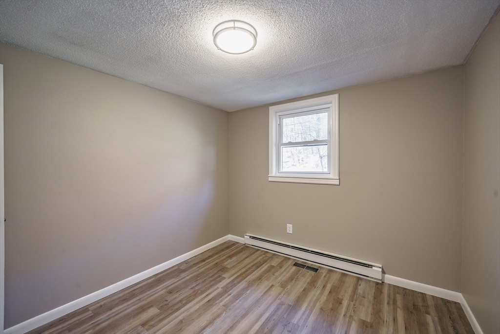 172 Bumstead Road Monson, MA 01057 - Photo 18 of 36 an empty room with a window