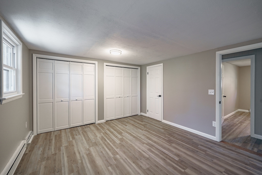 172 Bumstead Road Monson, MA 01057 - Photo 25 of 36 a view of an empty room with wooden floor