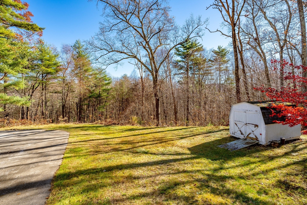 172 Bumstead Road Monson, MA 01057 - Photo 32 of 36 a view of a swimming pool with an outdoor space and seating area