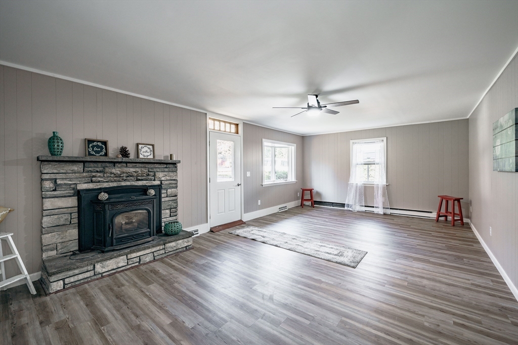 172 Bumstead Road Monson, MA 01057 - Photo 4 of 36 wooden floor fireplace and windows in an empty room