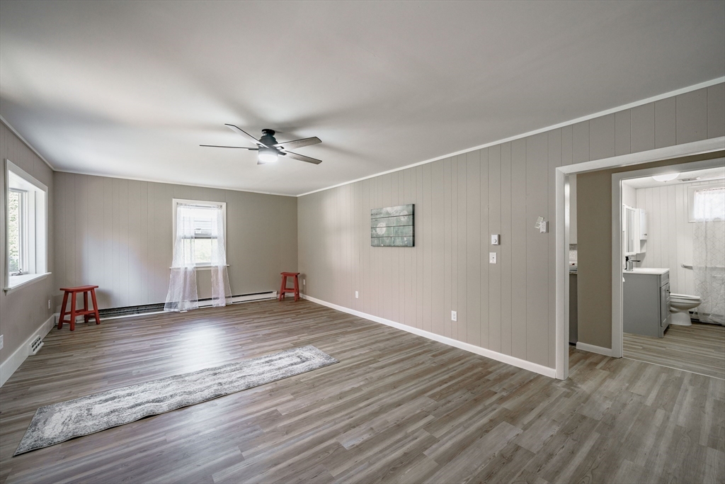 172 Bumstead Road Monson, MA 01057 - Photo 5 of 36 wooden floor in an empty room with a window