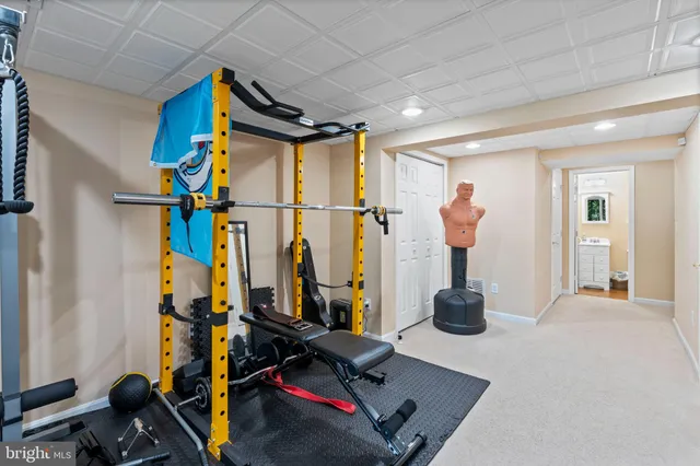 a bathroom with a toilet a sink and a mirror