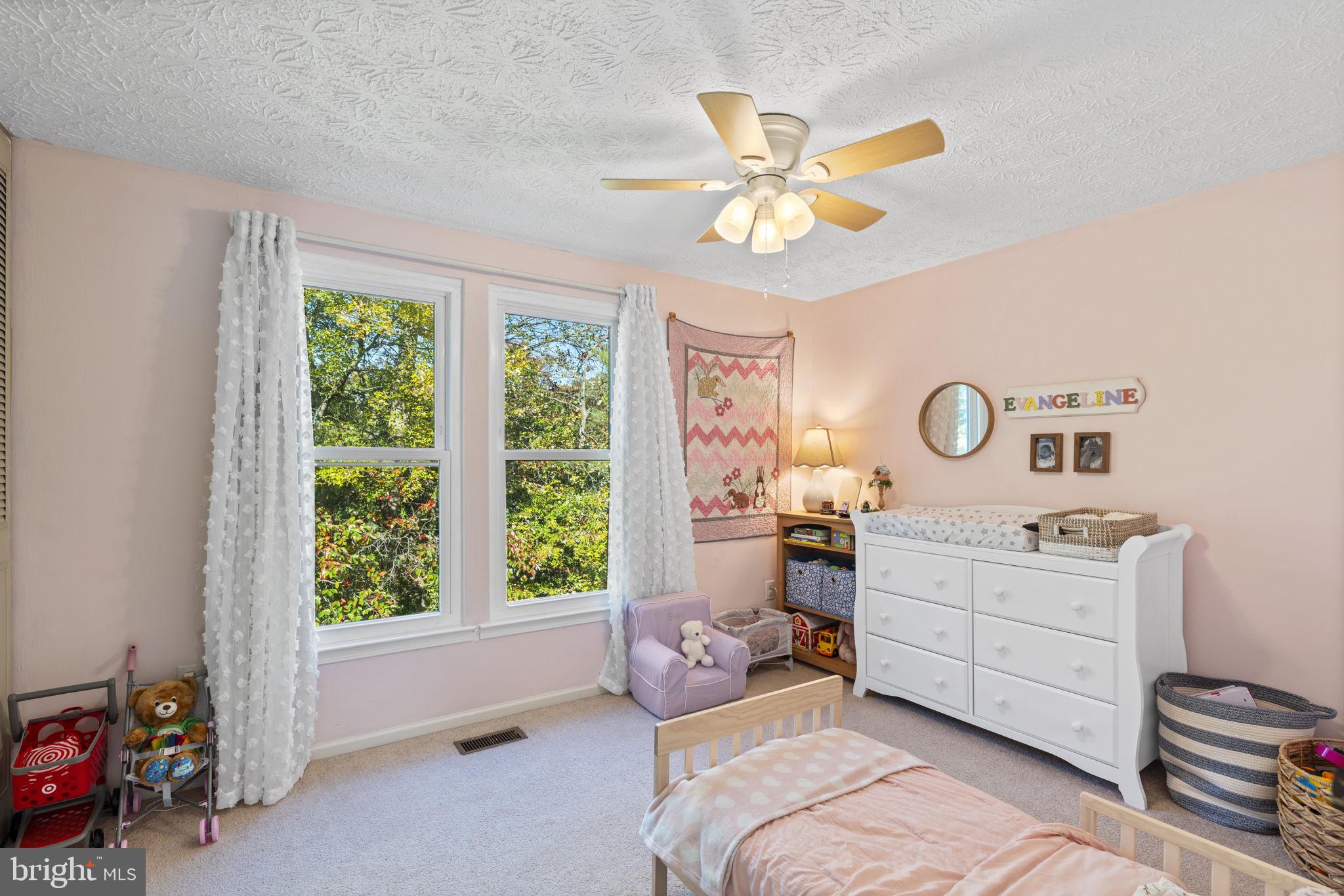 38 Trailwood Road Nottingham, MD 21236 - Photo 26 of 36 a bedroom with a bed and a chandelier