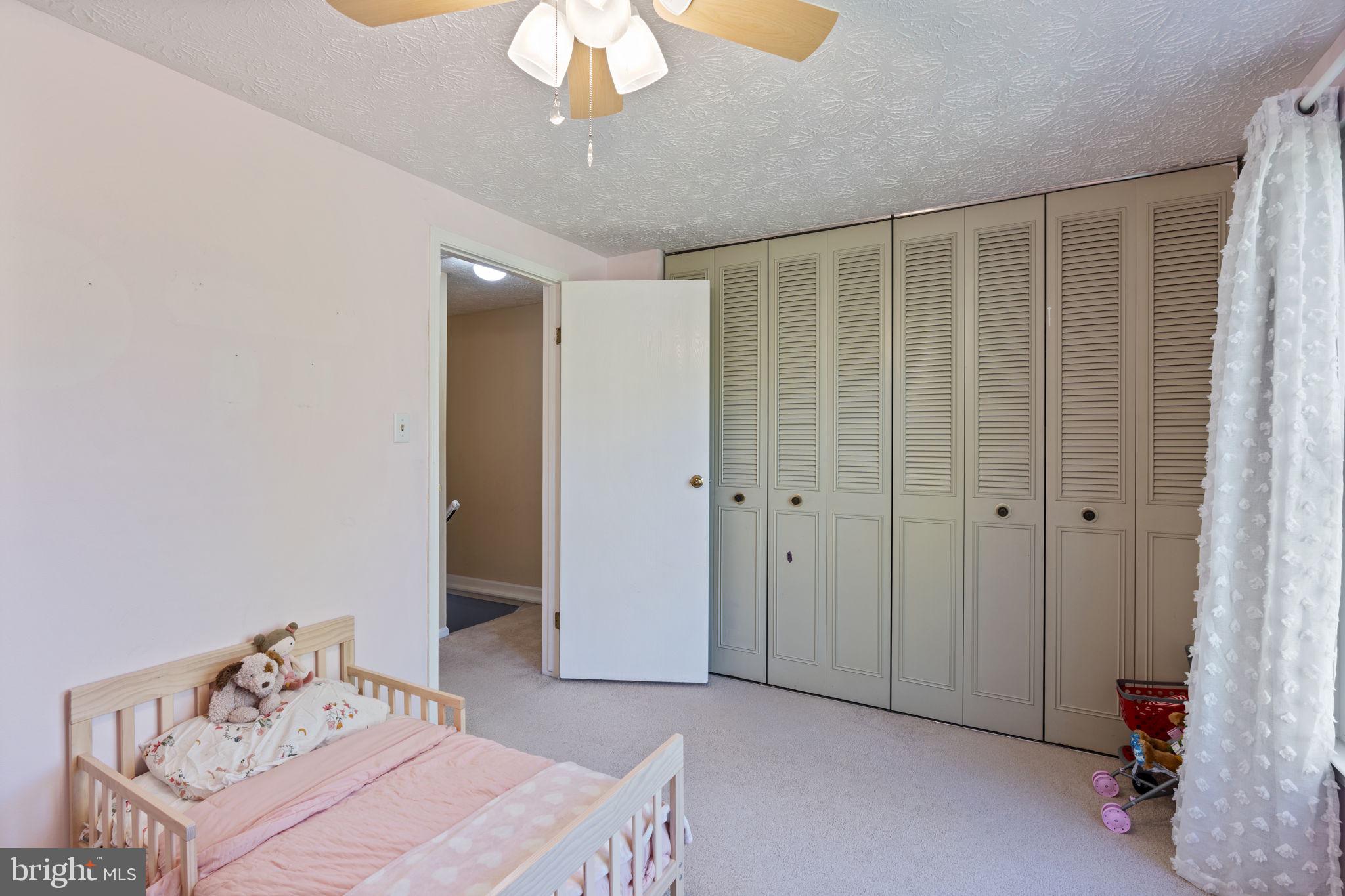 38 Trailwood Road Nottingham, MD 21236 - Photo 27 of 36 a bedroom with a bed and a chandelier fan