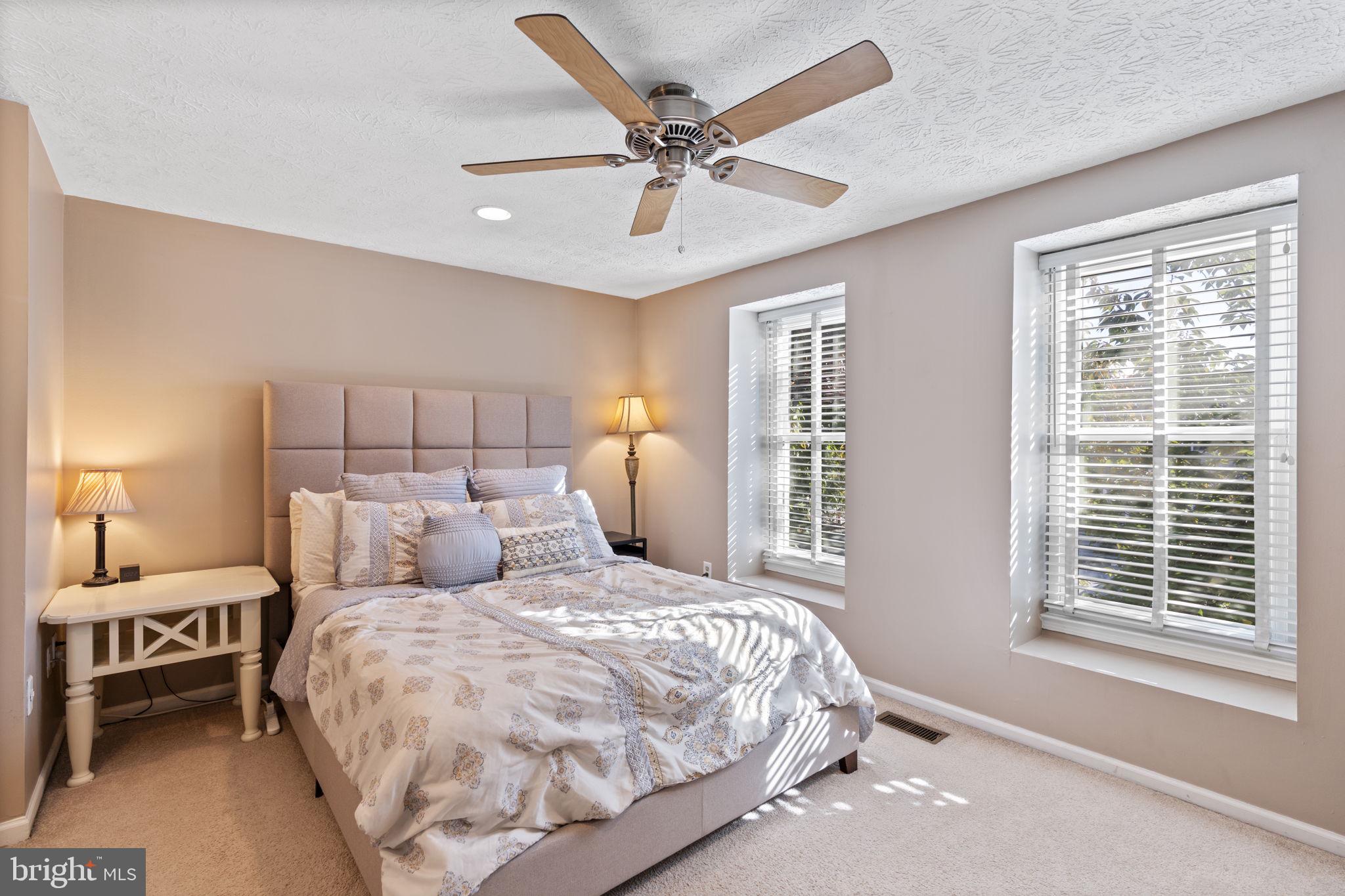 38 Trailwood Road Nottingham, MD 21236 - Photo 30 of 36 a bedroom with a large bed and a window