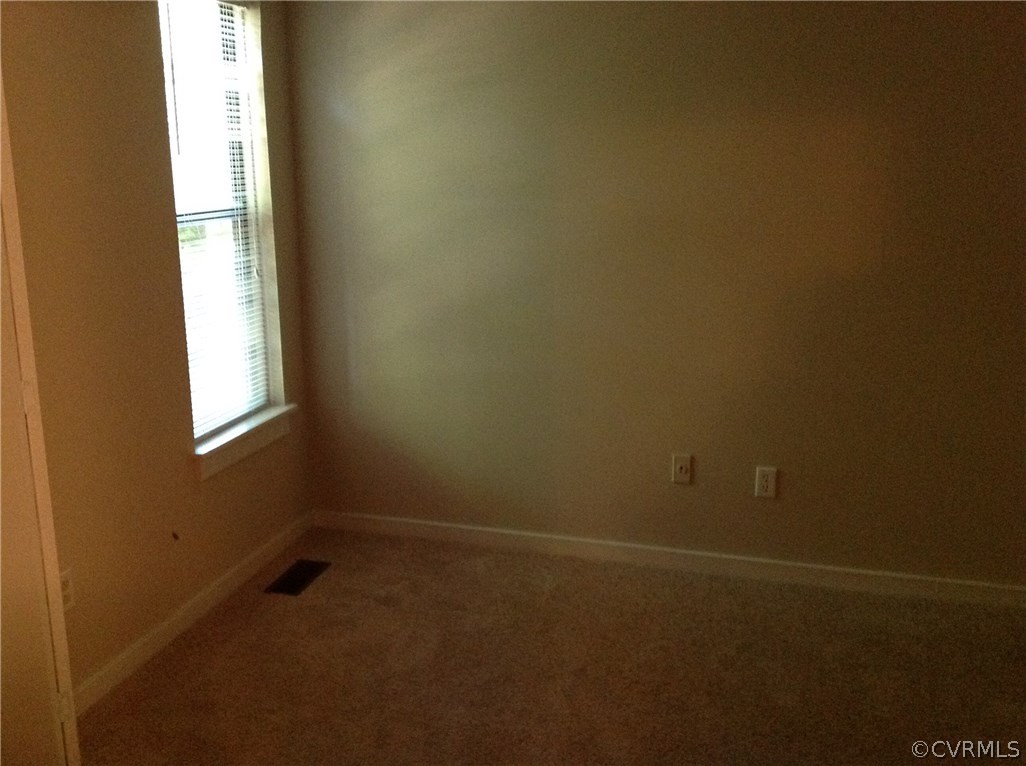 1500 Headwaters Road Midlothian, VA 23113 - Photo 8 of 9 an empty room with a window