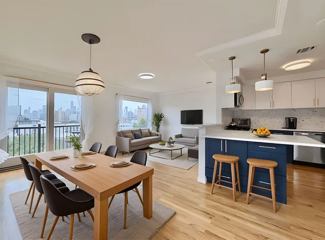 a view of a dining room with furniture window and wooden floor