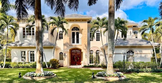 front view of a building with a garden