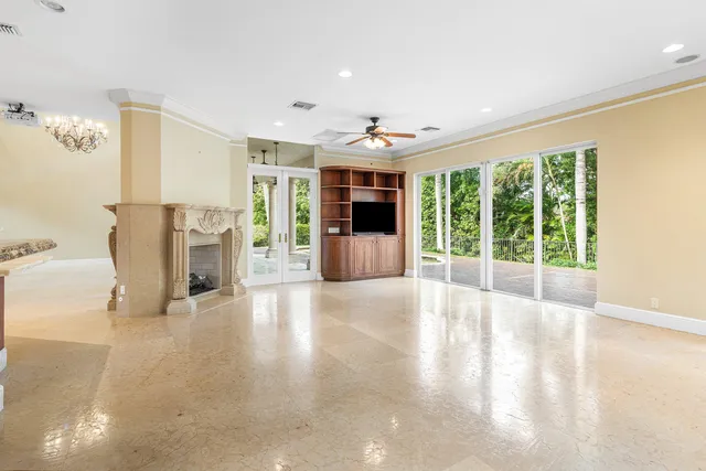 a bathroom with a granite countertop sink toilet a mirror and shower