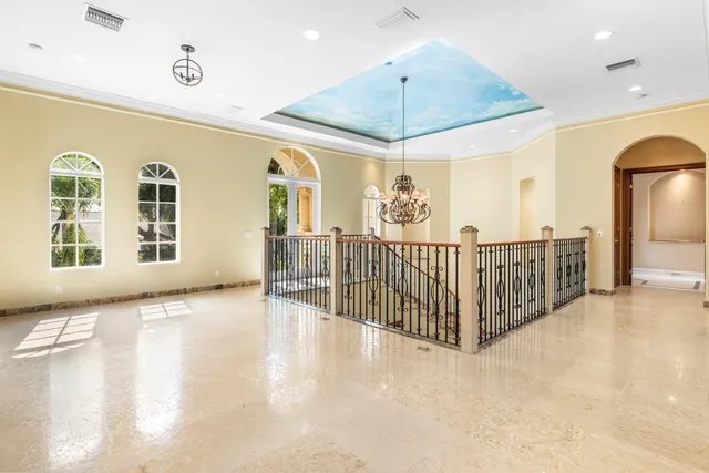a living room with stainless steel appliances granite countertop a stove a sink and a microwave