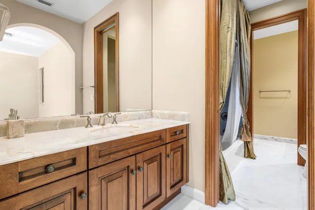 an aerial view of a residential houses with outdoor space and street view