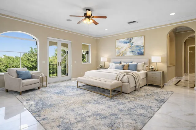 a bedroom with a bed and a painting on the wall