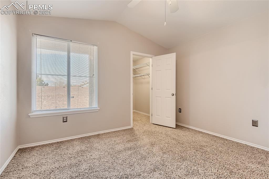 3780 Riviera Grove, Unit 204 Colorado Springs, CO 80922 - Photo 19 of 33 an empty room with a natural light