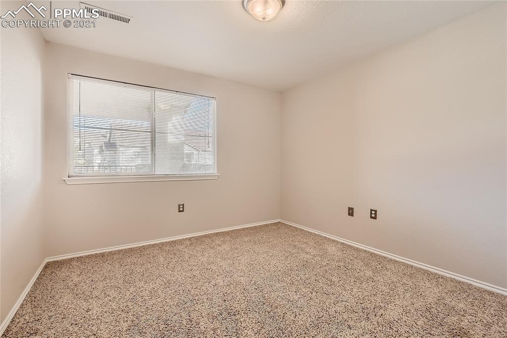 3780 Riviera Grove, Unit 204 Colorado Springs, CO 80922 - Photo 25 of 33 an empty room with a window