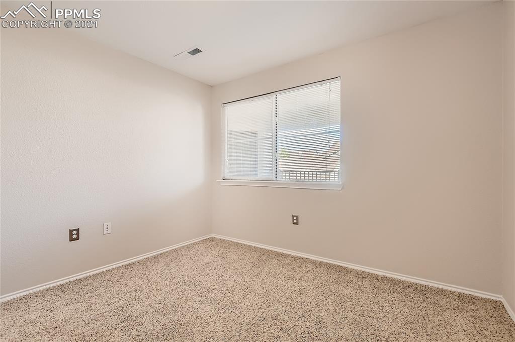 3780 Riviera Grove, Unit 204 Colorado Springs, CO 80922 - Photo 26 of 33 an empty room with a window