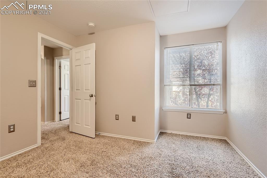 3780 Riviera Grove, Unit 204 Colorado Springs, CO 80922 - Photo 27 of 33 an empty room with windows and closet