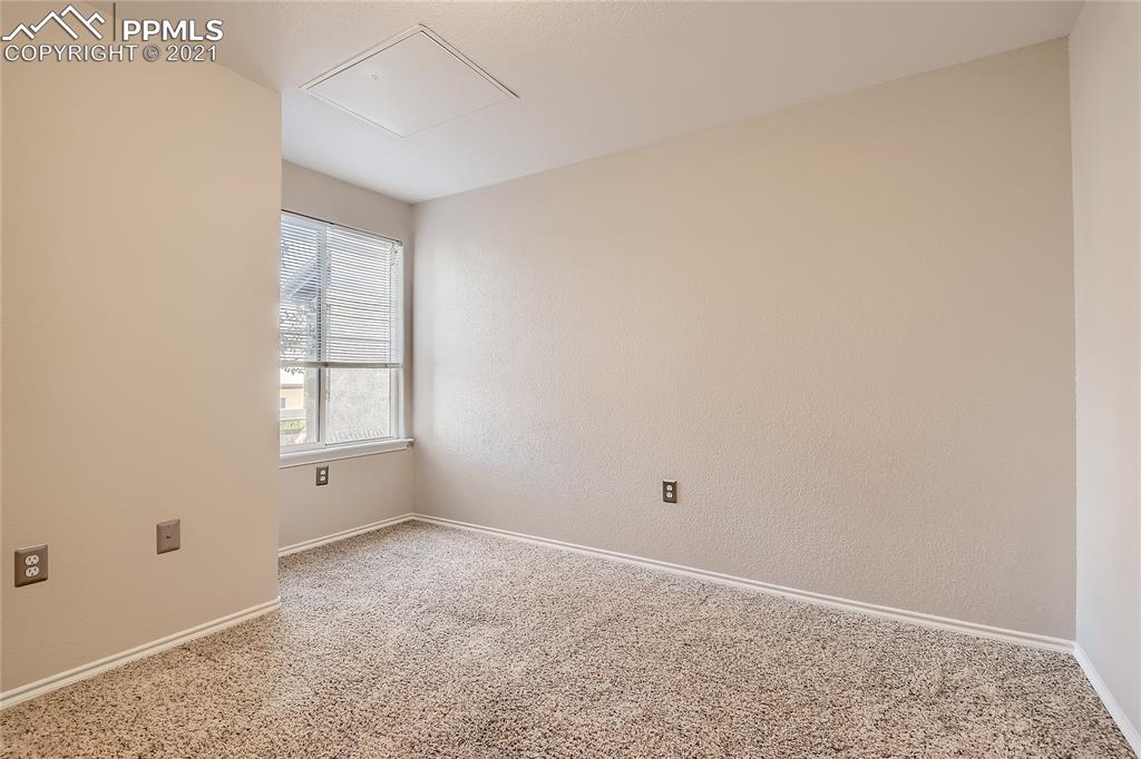 3780 Riviera Grove, Unit 204 Colorado Springs, CO 80922 - Photo 29 of 33 an empty room with windows
