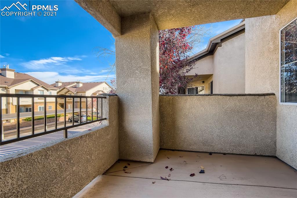 3780 Riviera Grove, Unit 204 Colorado Springs, CO 80922 - Photo 31 of 33 a view of a building from a balcony